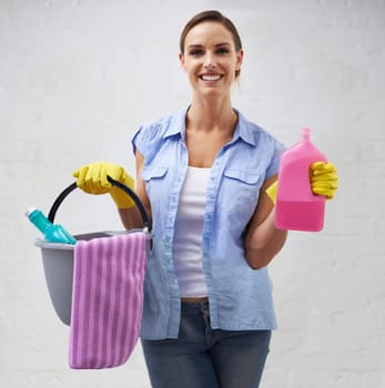 Bucket, soap and portrait of woman cleaning in bathroom, home or hotel with smile. Housework, mission and happy girl, housekeeper or cleaner service washing dirt, germs and chemical in apartment.