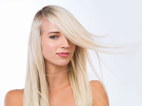 Blonde woman, hair care and studio portrait with smile, wellness or results for beauty by white background. Girl, person and model for hairstyle, transformation or change with natural glow for health.