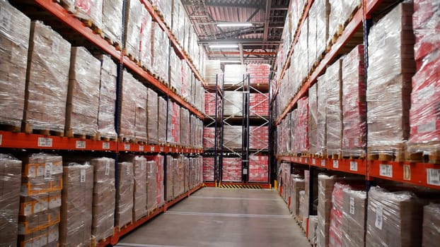Storage corridor with endless packed boxes of goods. Creative. Concept of worldwide sales