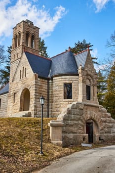 Gothic Revival Church in Fort Wayne's Lindenwood Cemetery, projecting historic charm under a clear Indiana sky.
