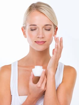 Woman, hand and moisturizer cream or skincare dermatology or healthy treatment, studio or white background. female person, product and sunscreen protection or face lotion, benefits or mockup space.