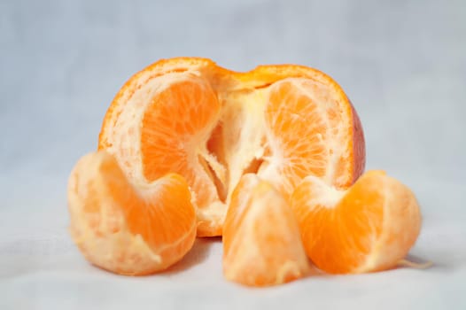 A peeled orange with the inside exposed. High quality photo