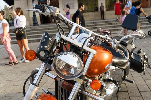 Warsaw, Poland - August 6, 2023: Classic motorcycle Honda VTX 1300. Beautiful chrome-plated orange motorcycle.