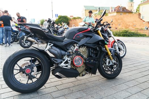 Warsaw, Poland - August 6, 2023: A ducati streetfighter v4 motorcycle is parked in the parking lot.