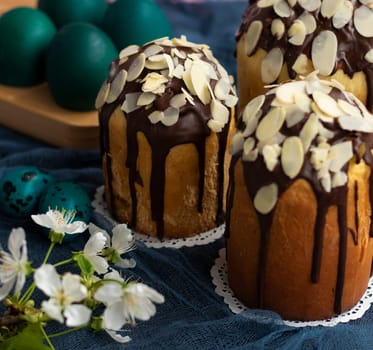 traditional Easter baking. Bun with chocolate and almond flakes. Selective focus. Sweet bread with chocolate. Special holiday baking decorated. High quality photo