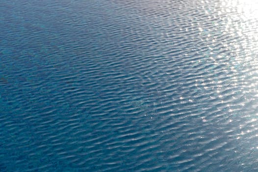Ripple Water in swimming pool with sun reflection 10