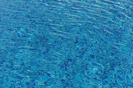Ripple Water in swimming pool with sun reflection 8