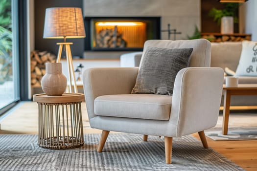 A cozy living room with furniture including a chair, table, lamp, and fireplace. The property features wood flooring, a rectangular layout, and a plant by the window