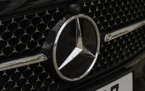 Gaziveren Cyprus 03.20.2024 - Mercedes logo on a black background with raindrops 1