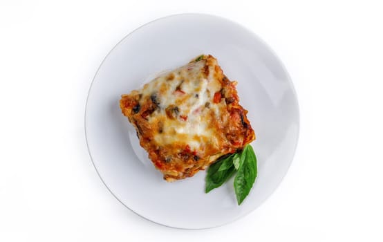 Tasty serving of traditional Italian lasagne with spicy tomato based ground beef and melted mozzarella cheese between layers of noodles