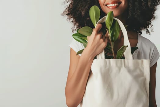 Close up of woman with tote bag mockup on white studio background.