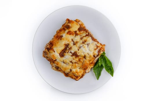 Tasty serving of traditional Italian lasagne with spicy tomato based ground beef and melted mozzarella cheese between layers of noodles 1