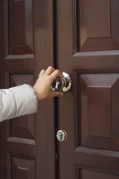 women hand knock the door.