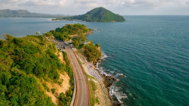 car driving on the curved road of Thailand. road landscape in summer. it's nice to drive on the beachside highway. Chantaburi Province Thailand Gulf of Thailand