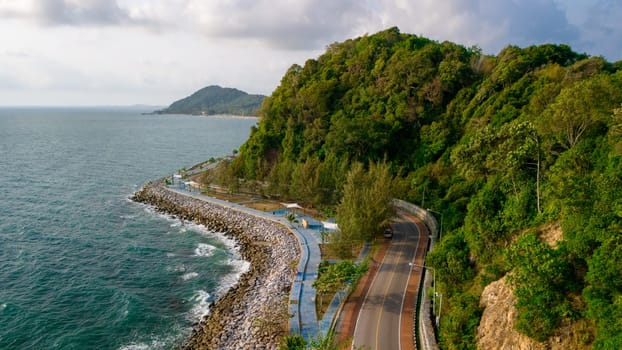 car driving on the curved road of Thailand. road landscape in summer. it's nice to drive on the beachside highway. Chantaburi Province Thailand, beautiful coastal ride