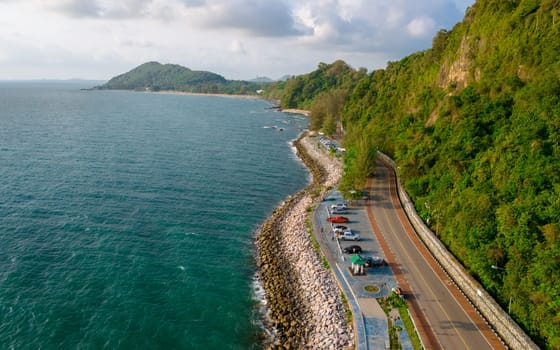 car driving on the curved road of Thailand. road landscape in summer. it's nice to drive on the beachside highway. Chantaburi Province Thailand, summer vacation road trip