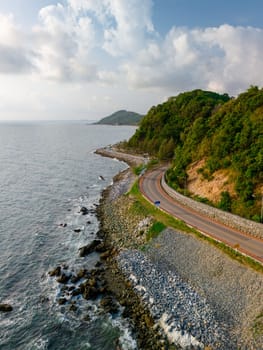 car driving on the curved road of Thailand. road landscape in summer. it's nice to drive on the beachside highway. Chantaburi Province Thailand, vertical horizon