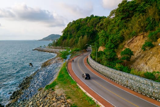 car driving on the curved road of Thailand. road landscape in summer. it's nice to drive on the beachside highway. Chantaburi Province Thailand,