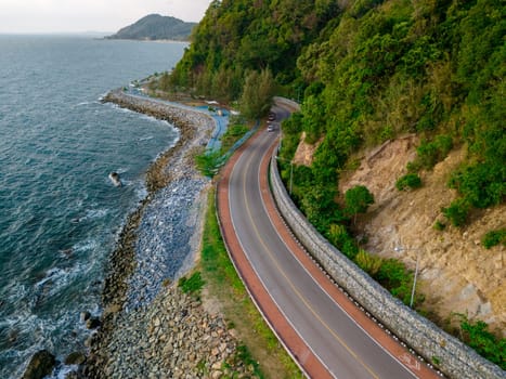 curved road alongside the ocean beach road of Thailand. road landscape in summer. it's nice to drive on the beachside highway. Chantaburi Province Thailand,