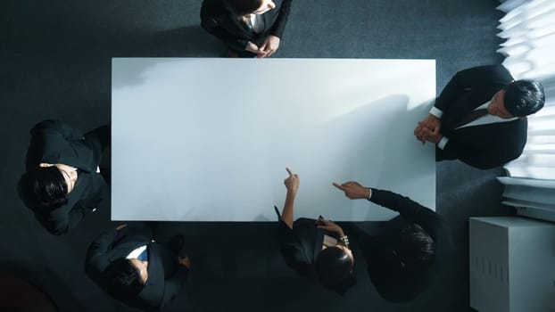 Top down aerial view of business team discuss about marketing strategy while project manager talking about financial plan. Diverse people brainstorming creative idea. Group plan project.. Directorate.