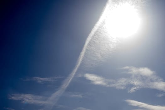 White spindrift clouds on blue sky, background - image