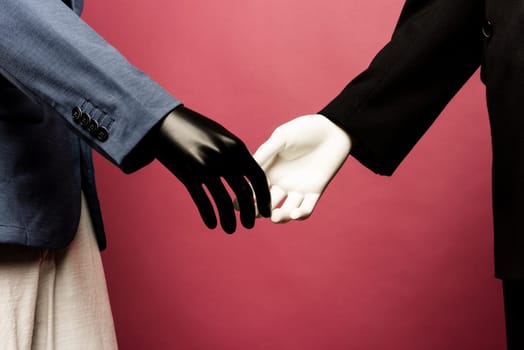 Focus on handshake of partners at meeting. shaking hands mannequin