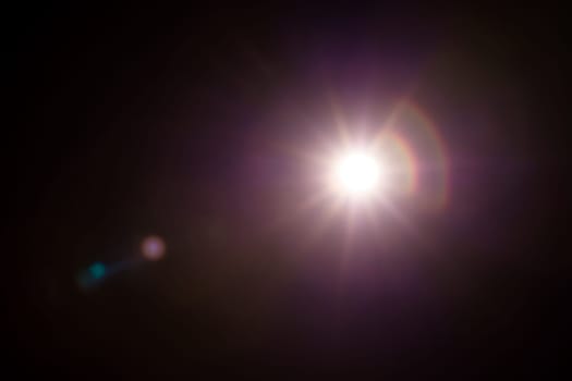 Abstract Natural Sun flare on the black.