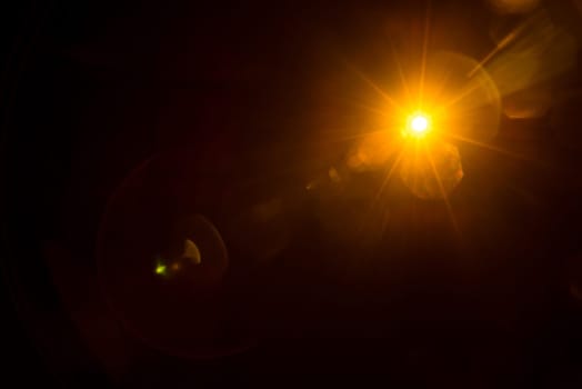 Abstract Natural Sun flare on the black.