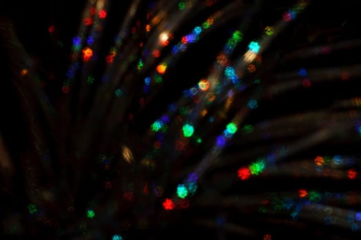Christmas background. Festive abstract background with bokeh defocused lights and stars.