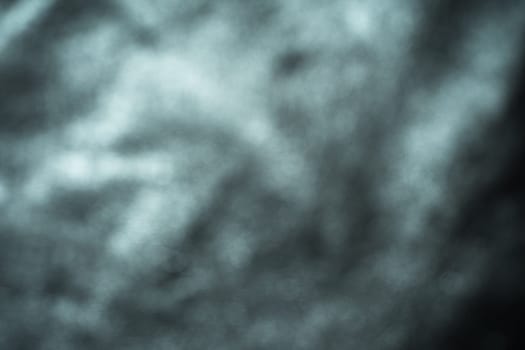 Black leather background with rich texture detail. close-up of black leather. A blurred background.