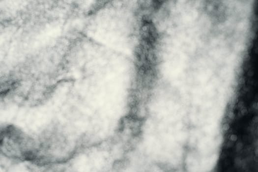 Black leather background with rich texture detail. close-up of black leather. A blurred background.