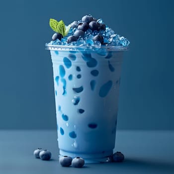 A liquid beverage made with electric blue bilberry juice and natural ice, served in a stylish plastic cup with fresh blueberries for a trendy fashion accessory