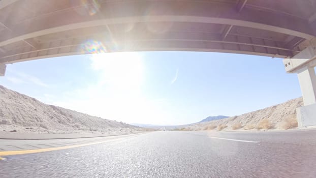 Embarking on a road trip from Nevada to California, driving on Highway 15 during the day offers scenic views and an exciting journey between states.