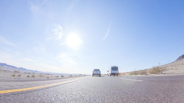 Embarking on a road trip from Nevada to California, driving on Highway 15 during the day offers scenic views and an exciting journey between states.