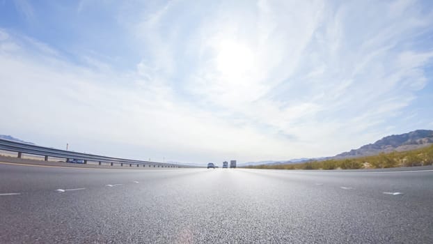 Embarking on a road trip from Nevada to California, driving on Highway 15 during the day offers scenic views and an exciting journey between states.