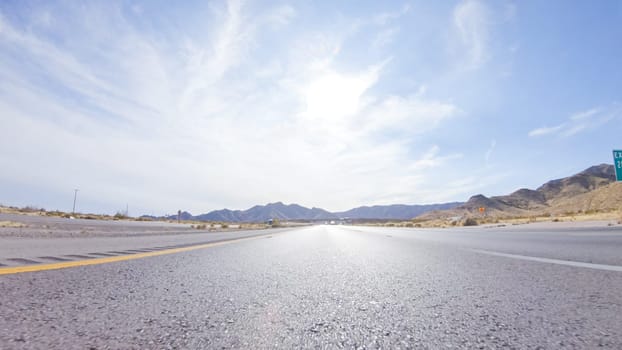 Embarking on a road trip from Nevada to California, driving on Highway 15 during the day offers scenic views and an exciting journey between states.