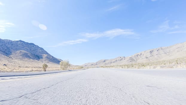 Embarking on a road trip from Nevada to California, driving on Highway 15 during the day offers scenic views and an exciting journey between states.