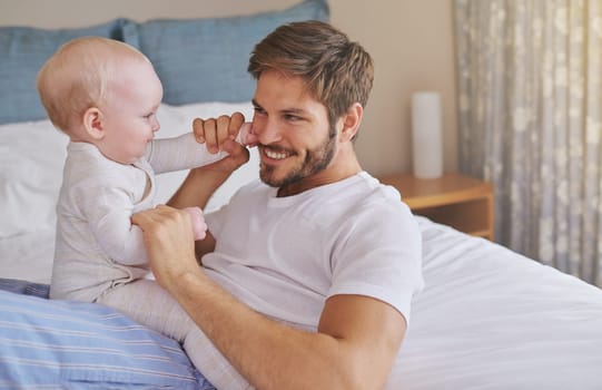 Family, playing and father with baby in bedroom for bonding, relationship and care for parenting. Happy, home and dad playing with newborn infant for child development, support and affection in house.