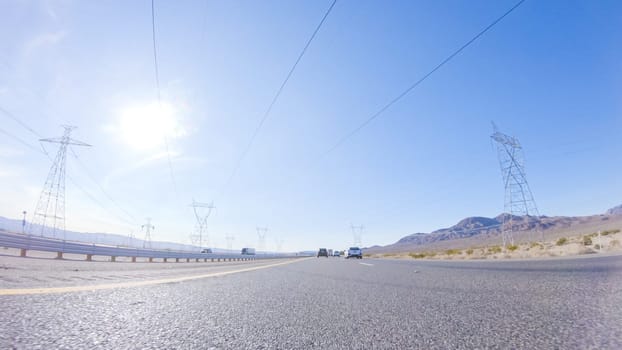 Embarking on a road trip from Nevada to California, driving on Highway 15 during the day offers scenic views and an exciting journey between states.