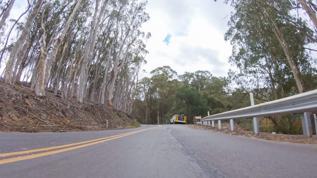 In this serene winter scene, a vehicle carefully makes its way along Los Osos Valley Road and Pecho Valley Road within Montana de Oro State Park.