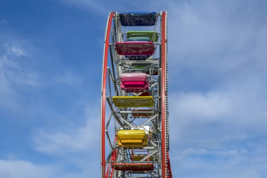 amusement park panoramic wheel on blue sky background