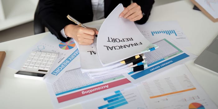 Documents, Business woman and accountant reading report for information, financial data or analysis. Paperwork, auditor check, review and bookkeeping, Calculate finance and tax in office.