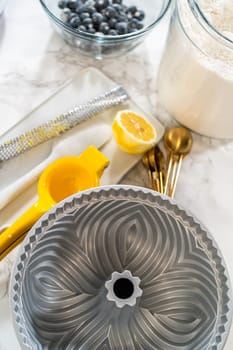 Carefully apply vegetable shortening to the bundt cake pan, ensuring a smooth, non-stick baking experience.