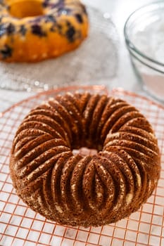 The artful extraction of the freshly baked bundt cake from its mold marks the exciting conclusion of the baking process.
