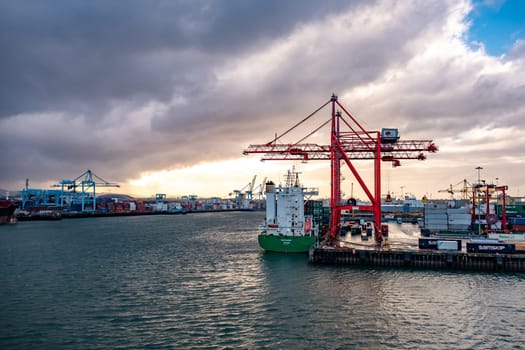 DUBLIN, IRELAND- MARCH 03 2019: Container cranes working at Dublin port.