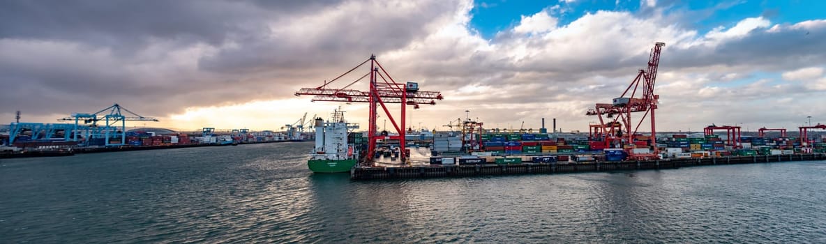 DUBLIN, IRELAND- MARCH 03 2019: Container cranes working at Dublin port.