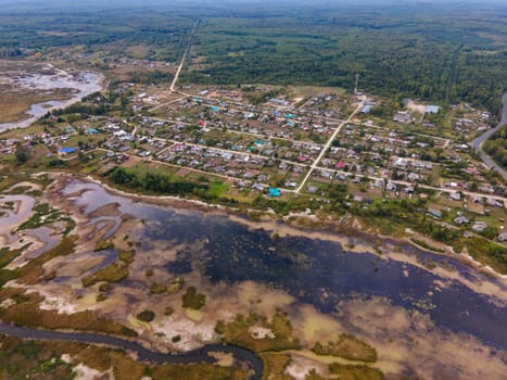 aerial view of suburbia between swamp and forest in Kirov Region of Russia. drone shot