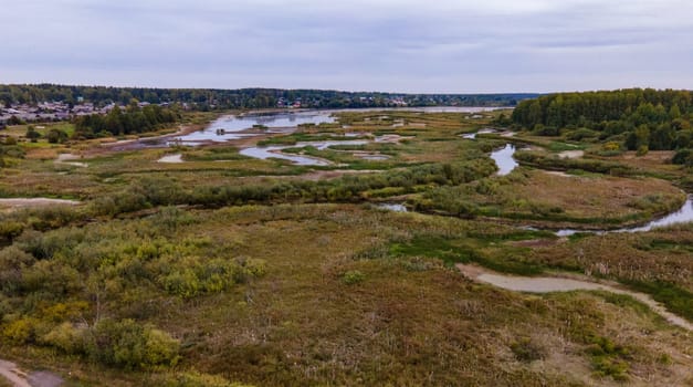 aerial view of suburbia between swamp and forest in Kirov Region of Russia. drone view