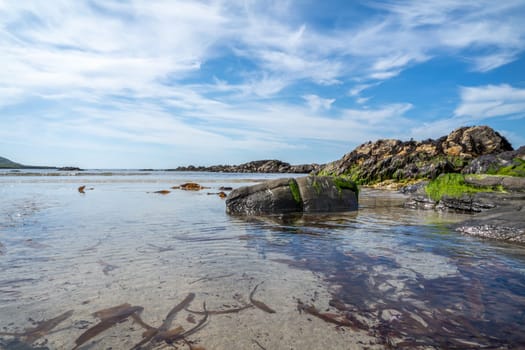 The rocks of Carrickfad by Portnoo at Narin Strand in County Donegal Ireland.