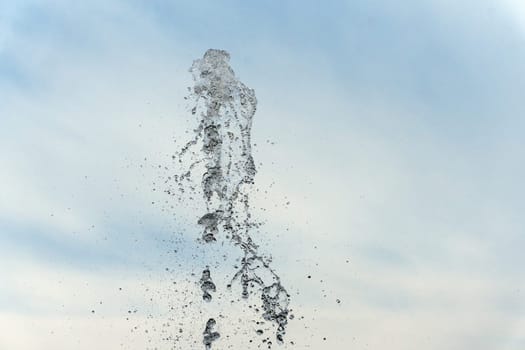 water spurt detail isolated on sky background